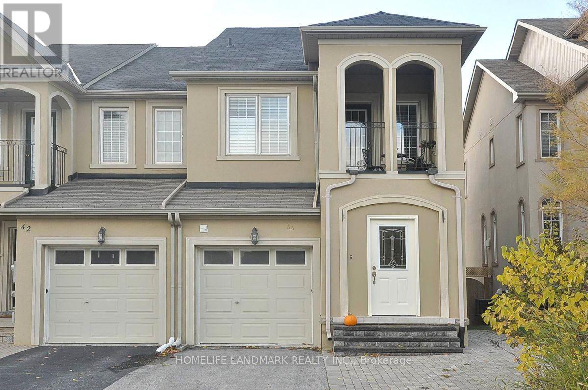 A two-story house with a garage is for sale.