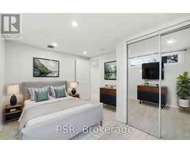 A bedroom with a large bed and a sliding glass door leading to a balcony.