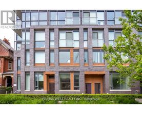 A modern building with a glass facade is shown with the RE/MAX West Realty logo in the corner.