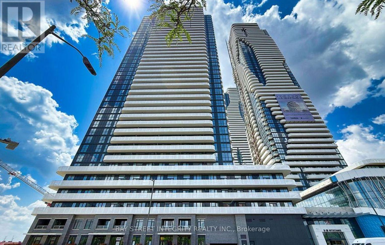 A tall building with a sign that says REALTY INC. Brokerage.