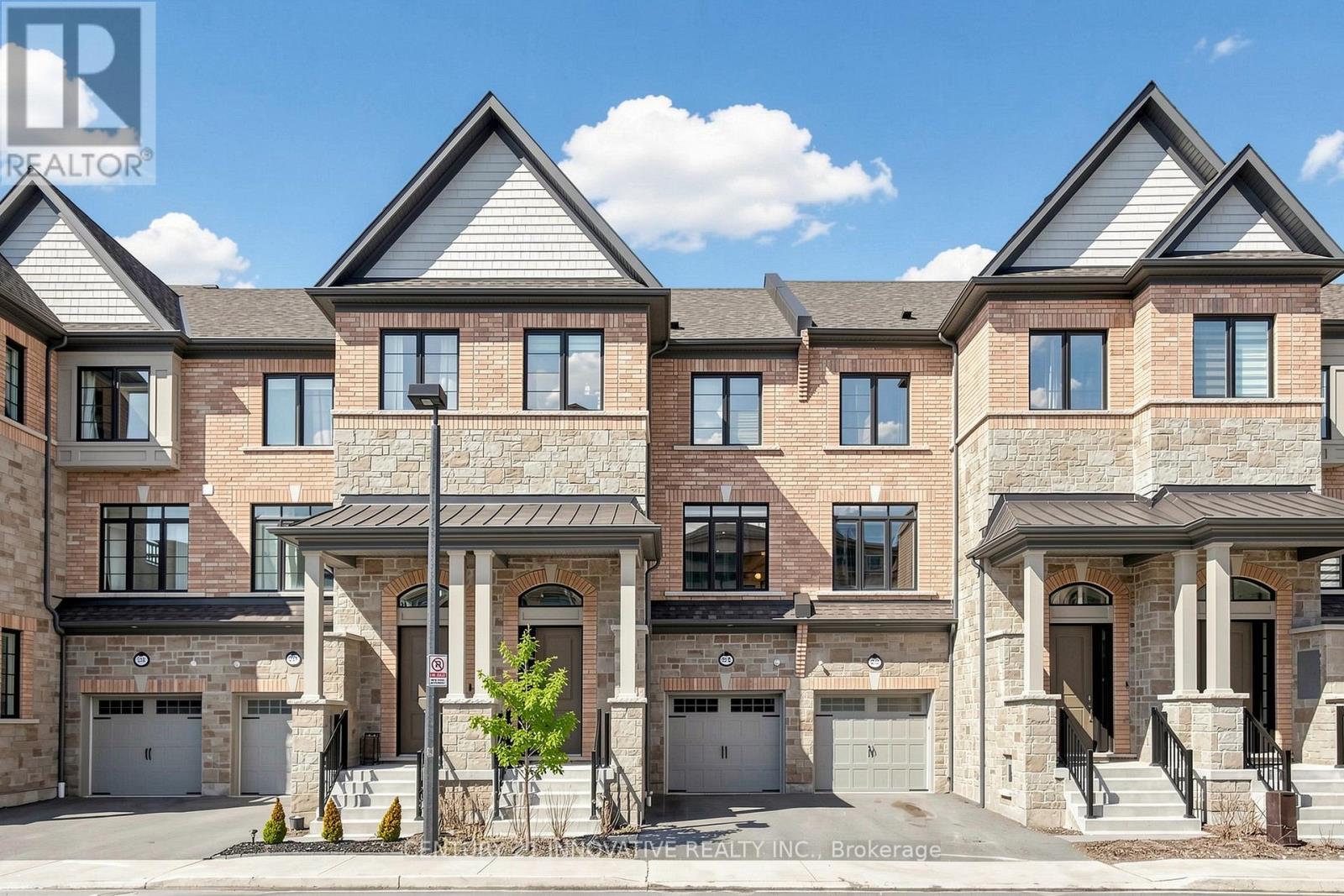 A large, multi-story residential building with a mix of brick and stone exterior.