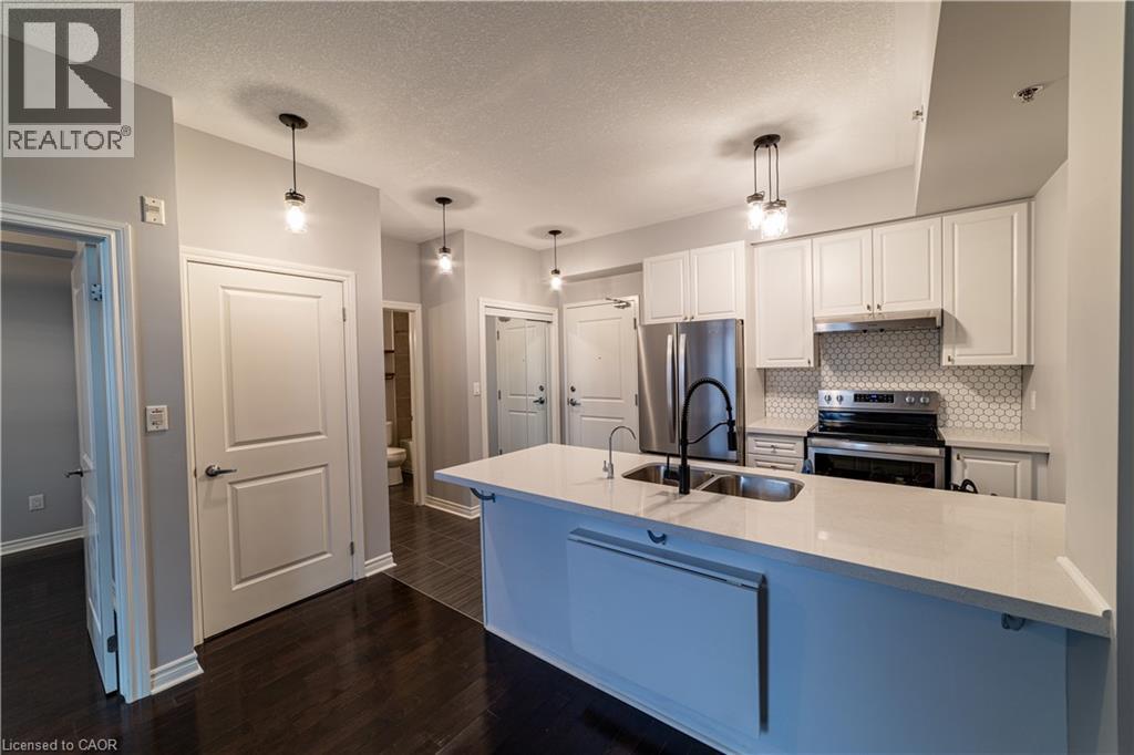 A kitchen with white cabinets and a blue island.