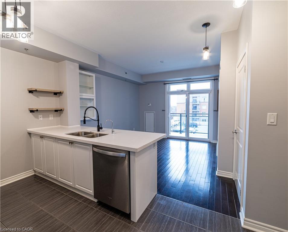 A modern kitchen with a sink and a dishwasher.