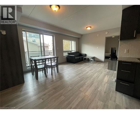 A living room with a dining table and chairs.