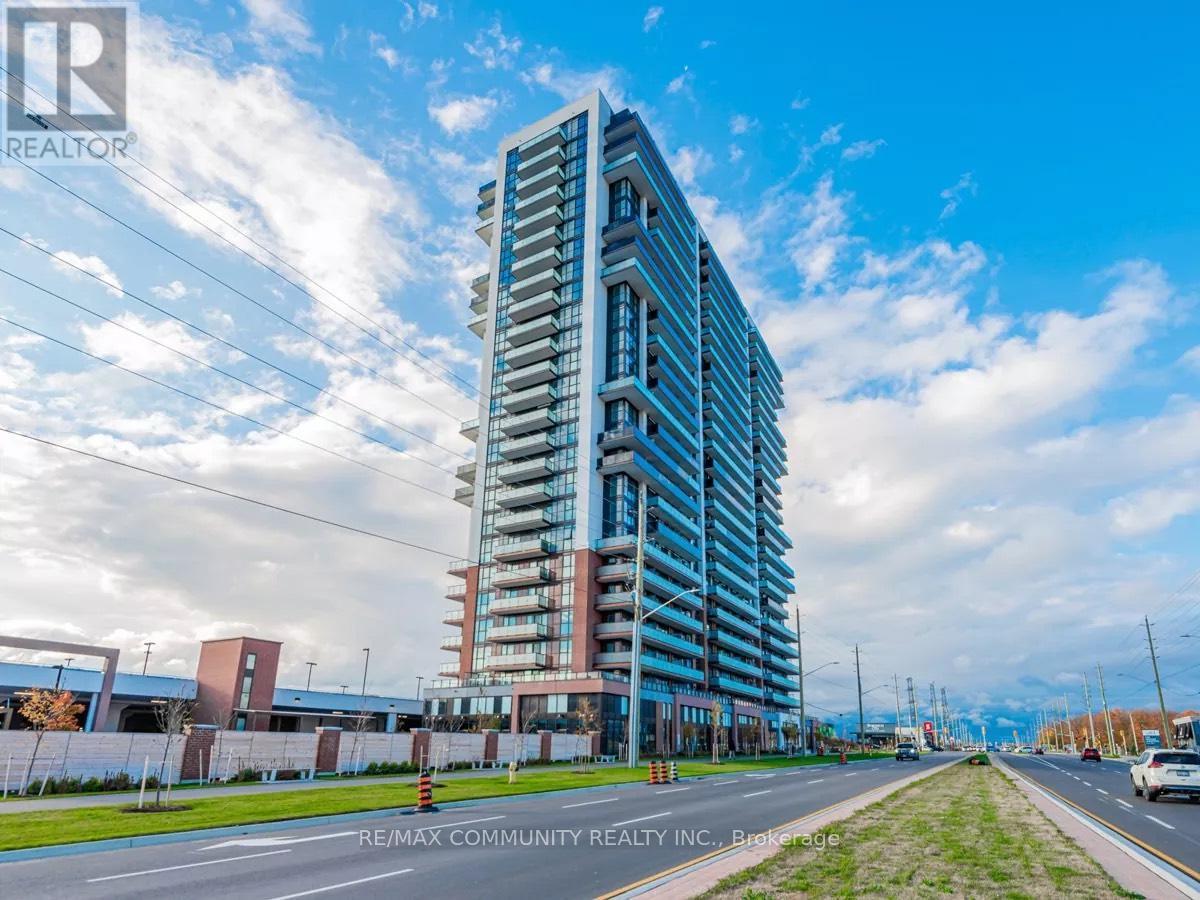 A tall, modern building with many windows is the focal point of the image.