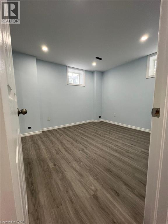 A room with light blue walls and wooden flooring.
