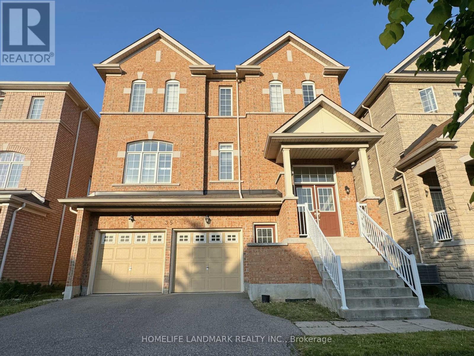 A large brick house with a garage is for sale.