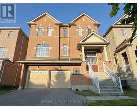 A large brick house with a garage is for sale.