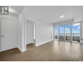 A spacious room with a view of the sky through the windows.