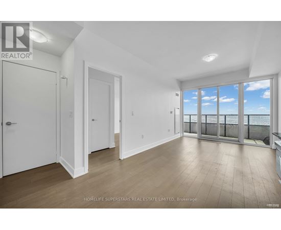 A spacious room with a view of the sky through the windows.