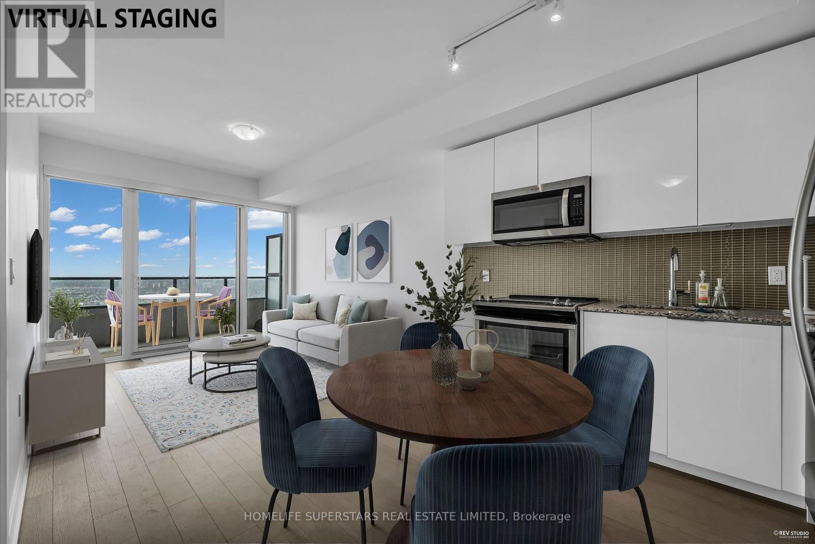 A modern kitchen with a dining table and chairs.