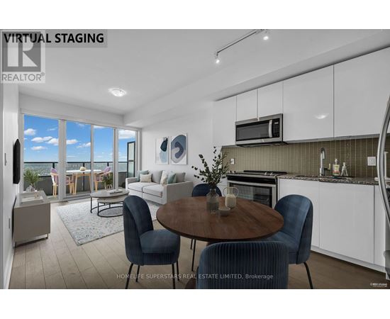 A modern kitchen with a dining table and chairs.