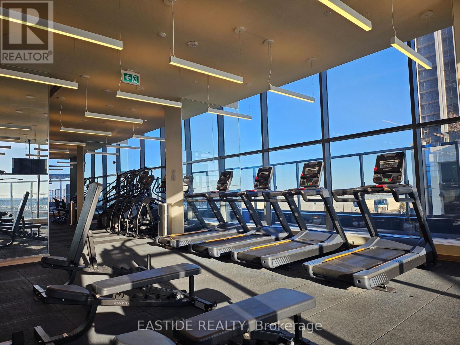 A gym with treadmills and exercise bikes.