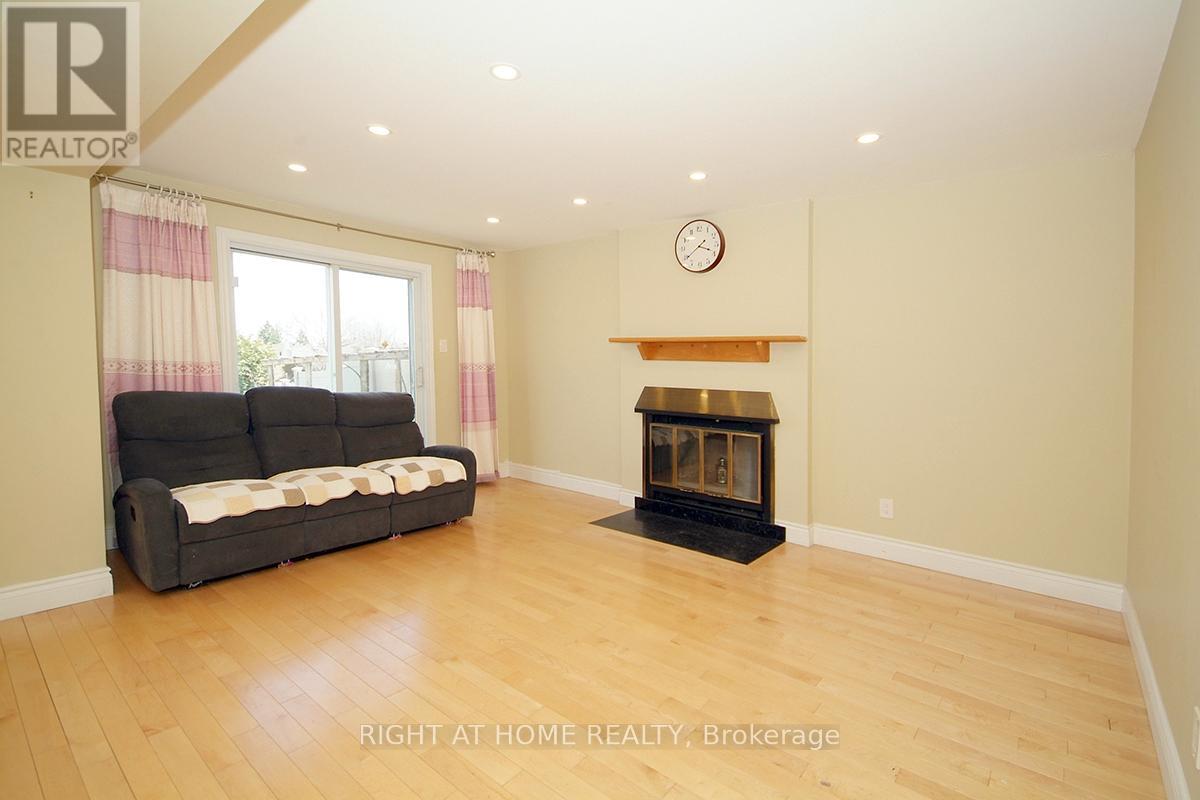A living room with a fireplace and a couch.