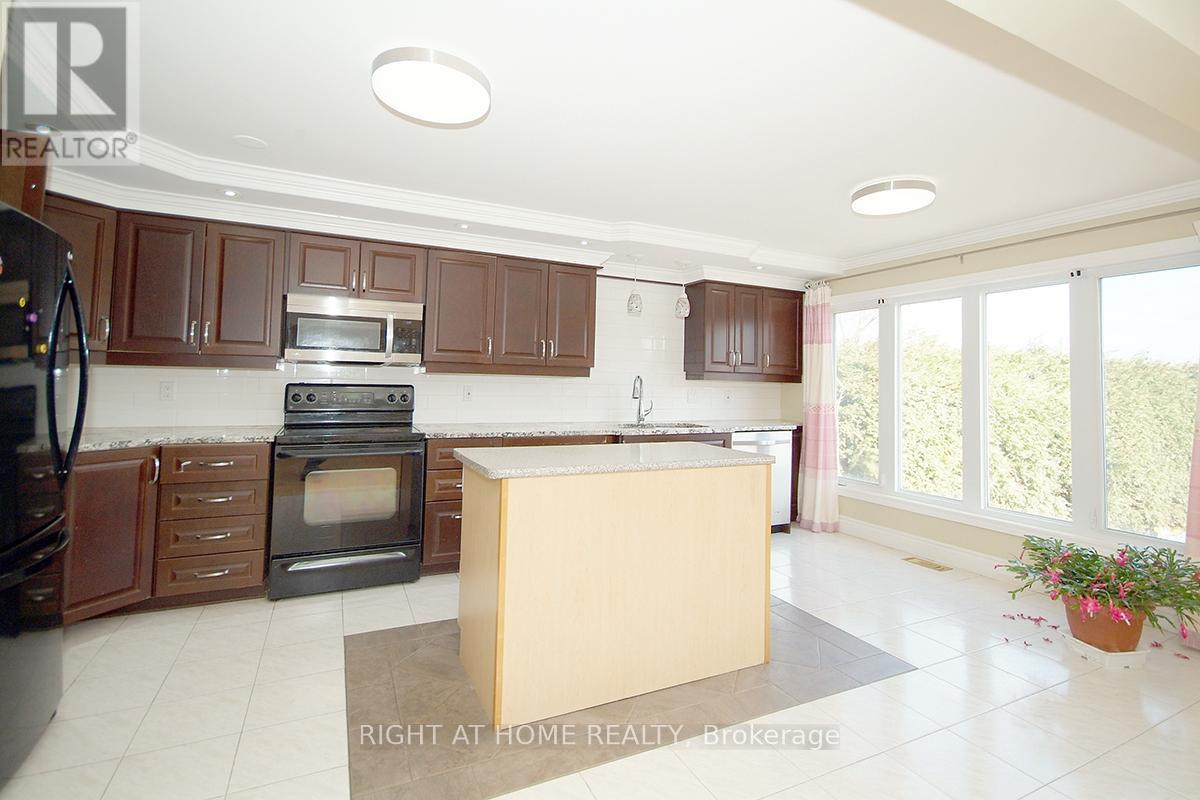 A kitchen with brown cabinets and a white island.