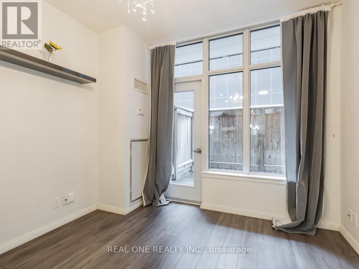 A room with a window and a door is shown.