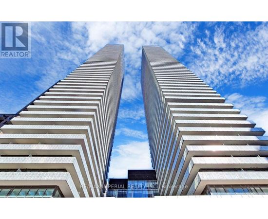 Two tall buildings with the logo REALTOR on the bottom.