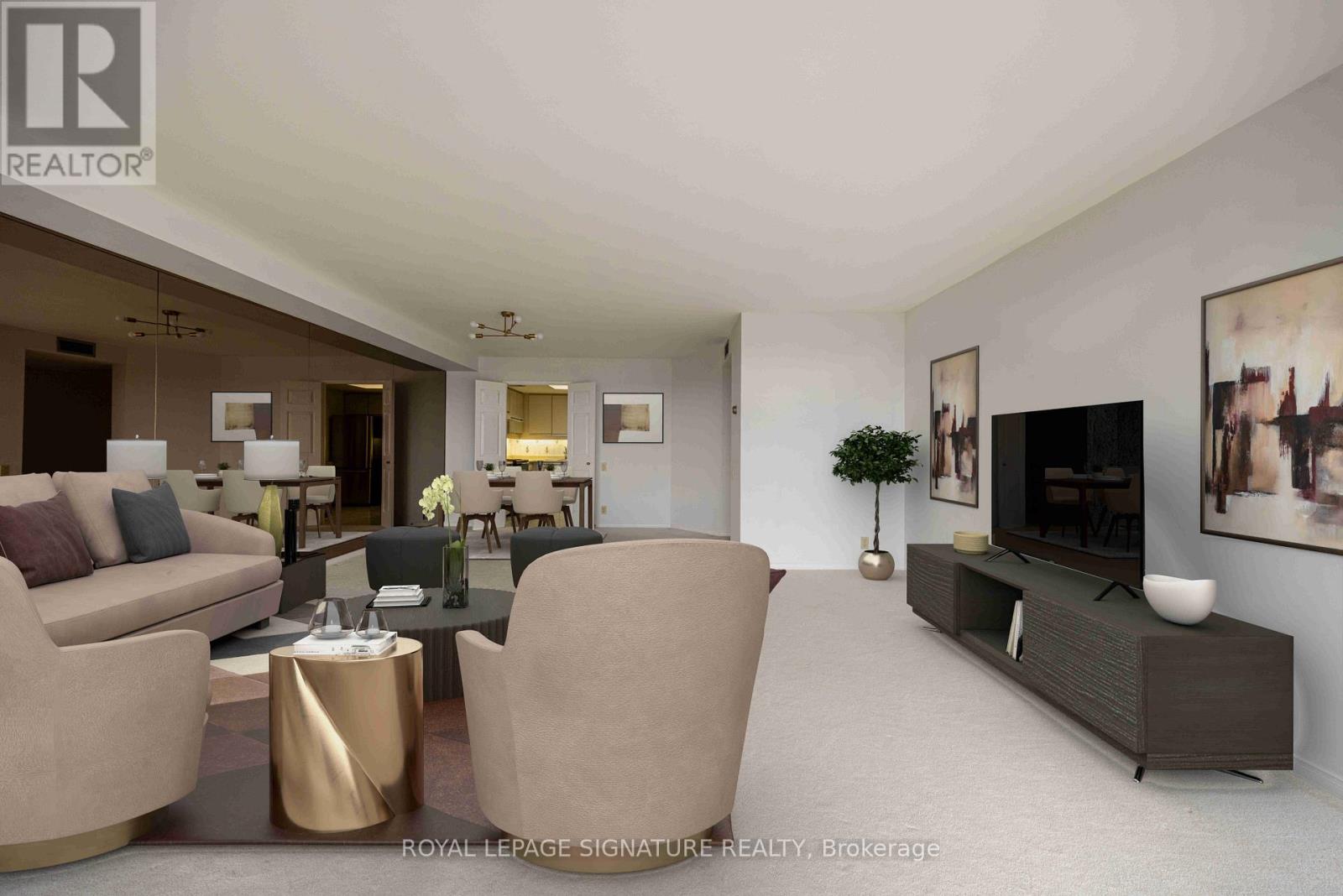 A living room with a couch, chairs, and a coffee table.