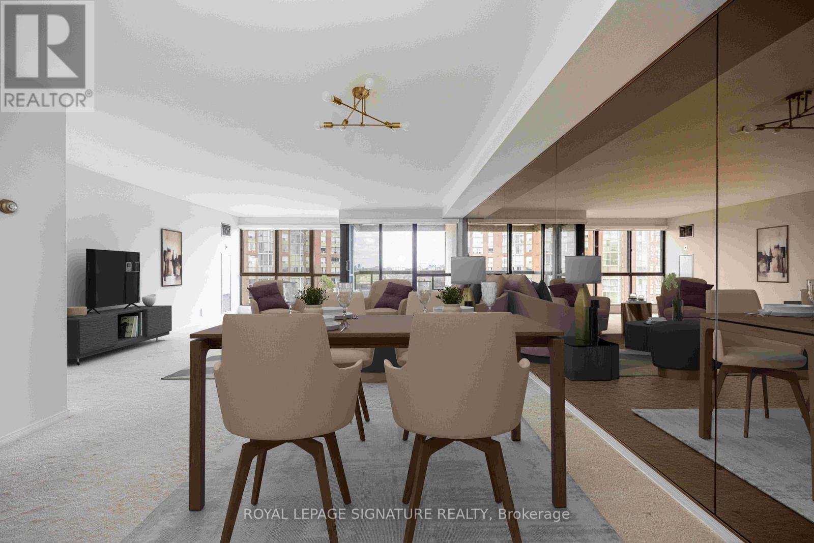 A modern dining room with a large table and chairs.