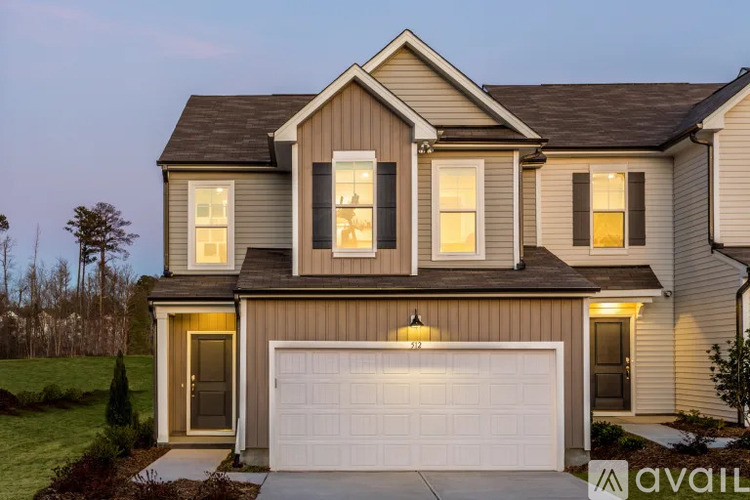 A house with a garage is available for sale.