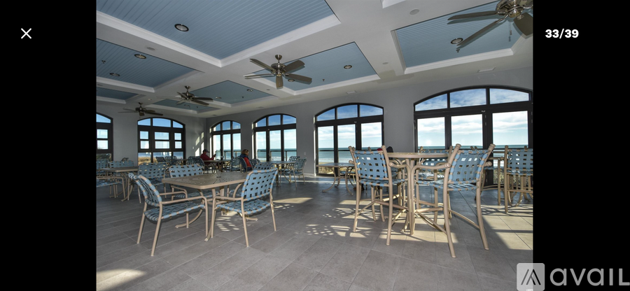 A dining room with a table set for six people.