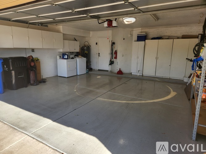 A spacious garage with a basketball court in the middle.