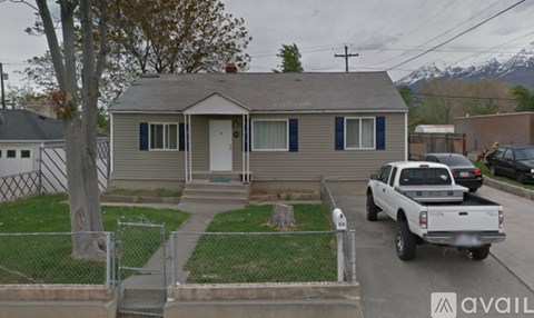 A house with a truck parked in front.