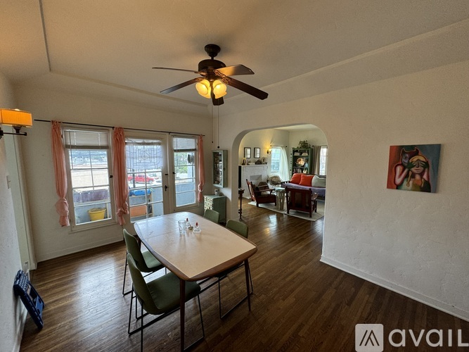 A dining room with a table and chairs is available for rent.
