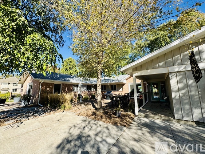 A sunny day at a residential area with houses and trees.