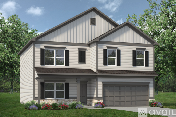 A two-story house with a garage is available for purchase.