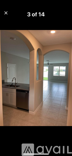 A kitchen with a sink and a dishwasher.