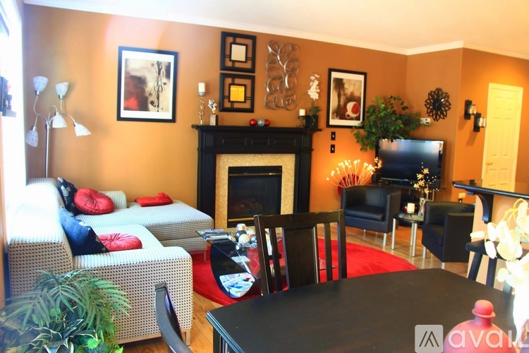 A living room with a fireplace and a couch.