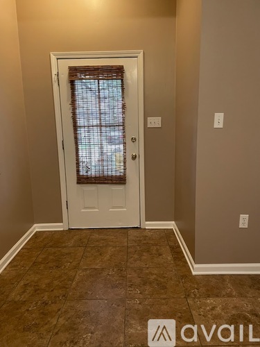 A room with a door and a window.