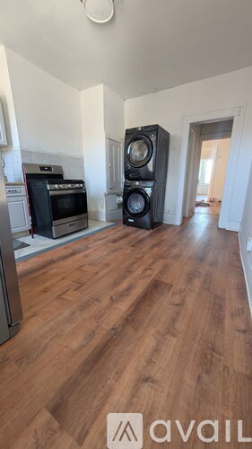 A room with wooden floors and a speaker in the corner.