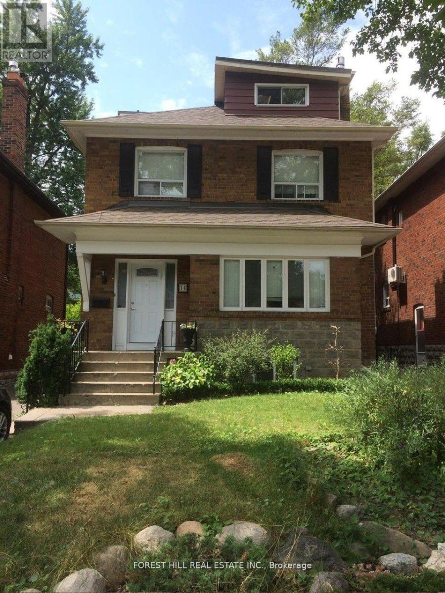 A house with a white door and windows is for sale.