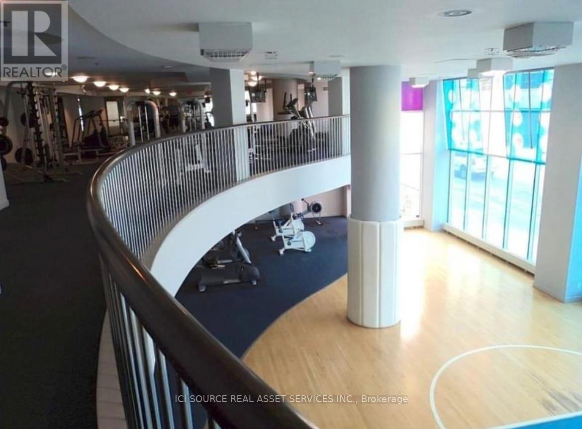 A gym with a variety of equipment and a yoga mat.