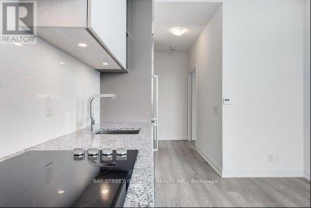 A modern kitchen with a countertop and a sink.