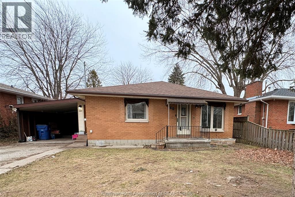 A house with a brown roof and a garage door.