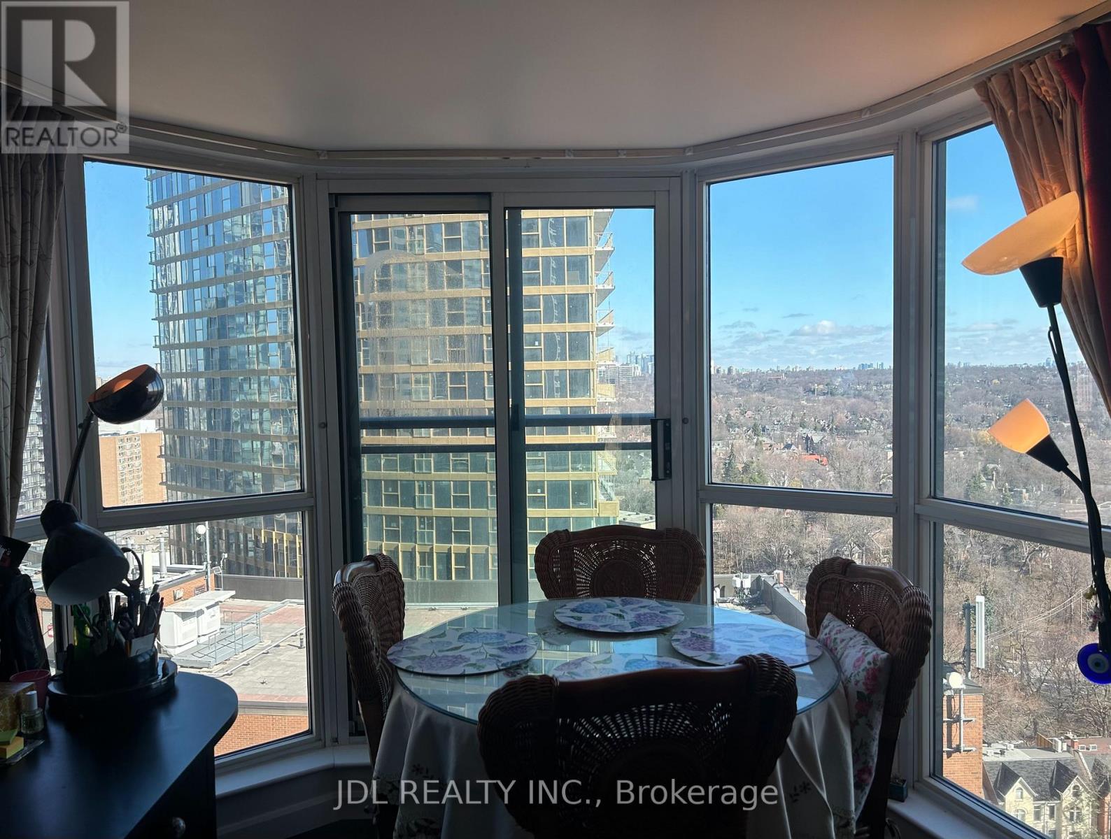 A dining room with a view of the cityscape.