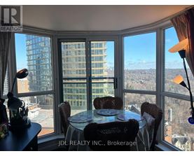 A dining room with a view of the cityscape.