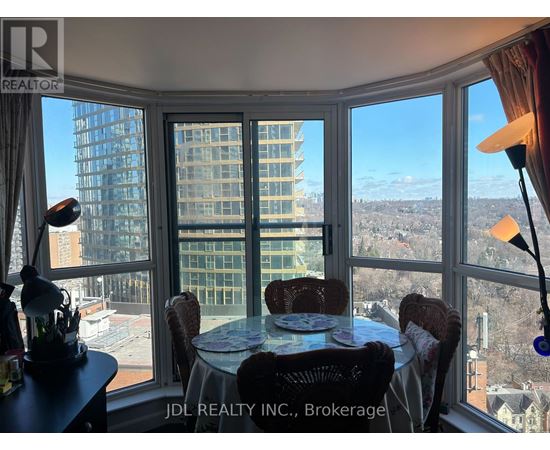 A dining room with a view of the cityscape.