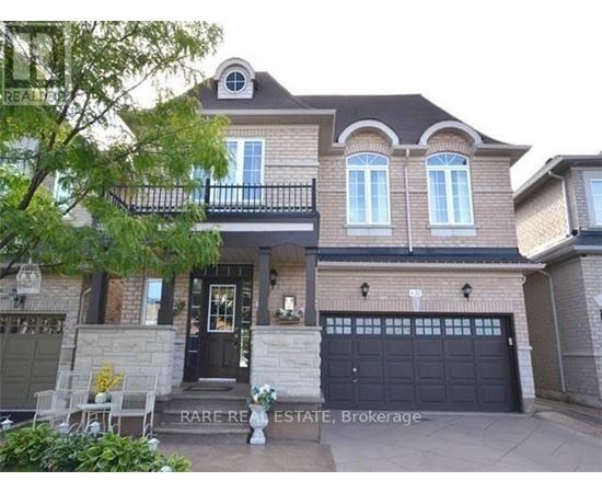 A two-story house with a balcony and a garage.