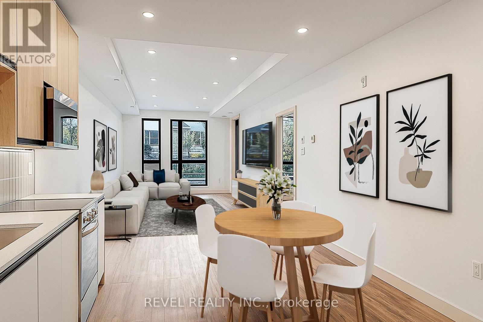 A modern dining room with a round table and chairs.