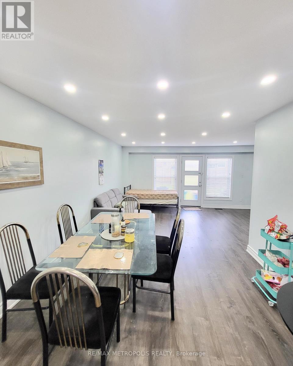 A dining room with a glass table and chairs.