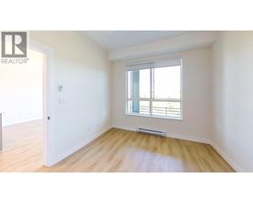 A room with a window and a door.