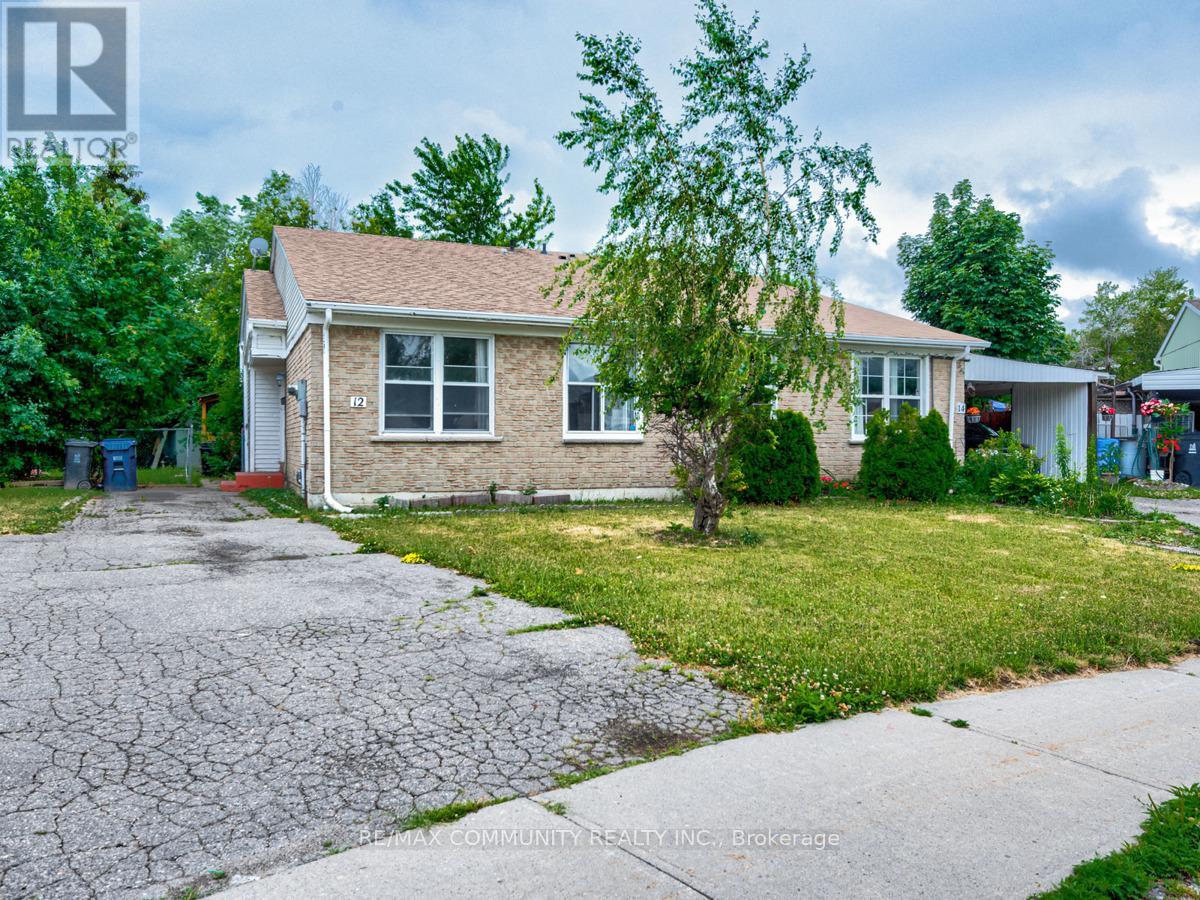 A house with a cracked driveway is for sale.