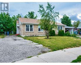 A house with a cracked driveway is for sale.