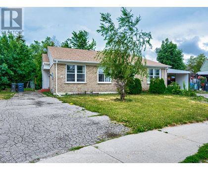 A house with a cracked driveway is for sale.