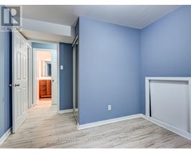 A room with blue walls and wooden flooring.
