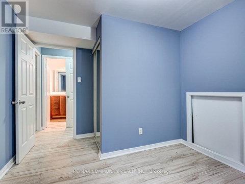 A room with blue walls and wooden flooring.
